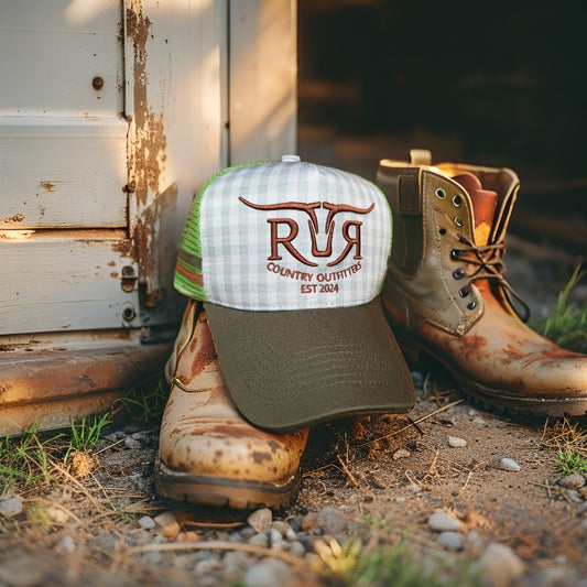 Cap and boots with 'Rustic Ridge Country Outfitters' branding on a rustic background